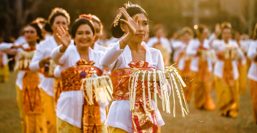 Group of Ladies playing their traditional form of music in an outdoor.