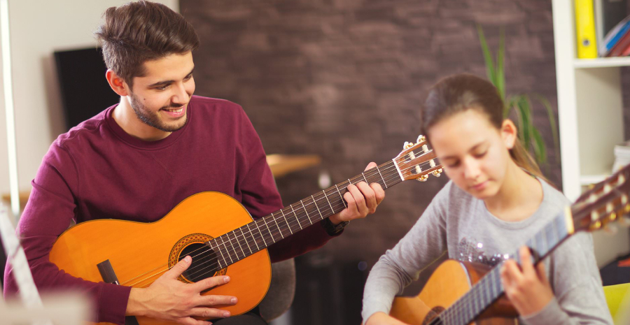 Two Guitarist playing and practicing notes for a song.