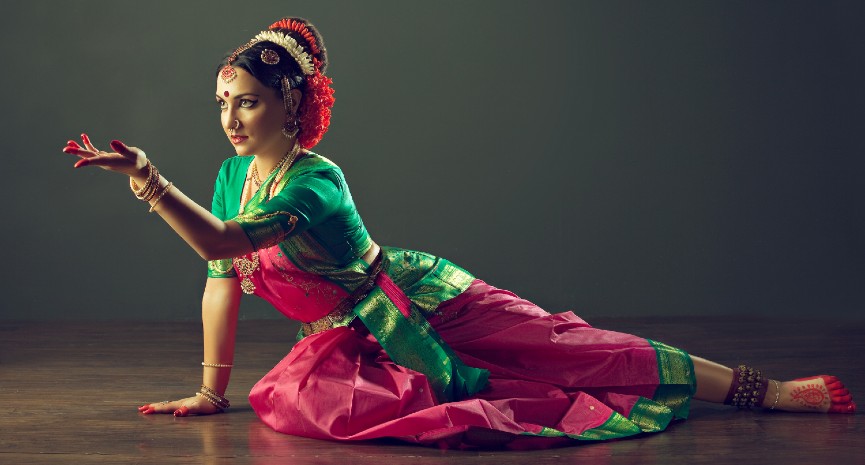 Beautiful Indian girl dancer in the Indian dance posture . Indian classical dance Bharatanatyam